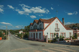 Fototapeta Dziecięca - House next to a road passing through countryside
