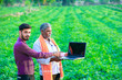 © PRASANNAPIX - indian agronomist with farmer at field