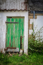 Old Green Wooden Doors On An Abandoned French Farmhouse 