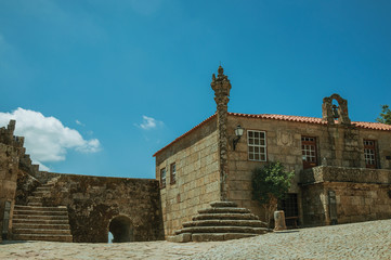 Wall Mural - Pillory in the middle of square encircled by old houses