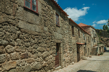 Wall Mural - Old house with wooden door and staircase on alley