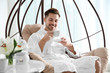 © New Africa - Handsome young man drinking tea in spa salon