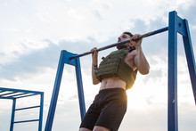 Young Bearded Athlete Training Outdoor With Weighted Vest,  Exercise With Military Plate Carrier
