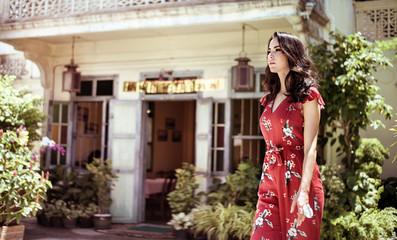 Wall Mural - Portrait of a brunette lady on a walk - vacation shot