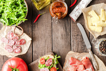 Italian appetizers on wooden table. Food background
