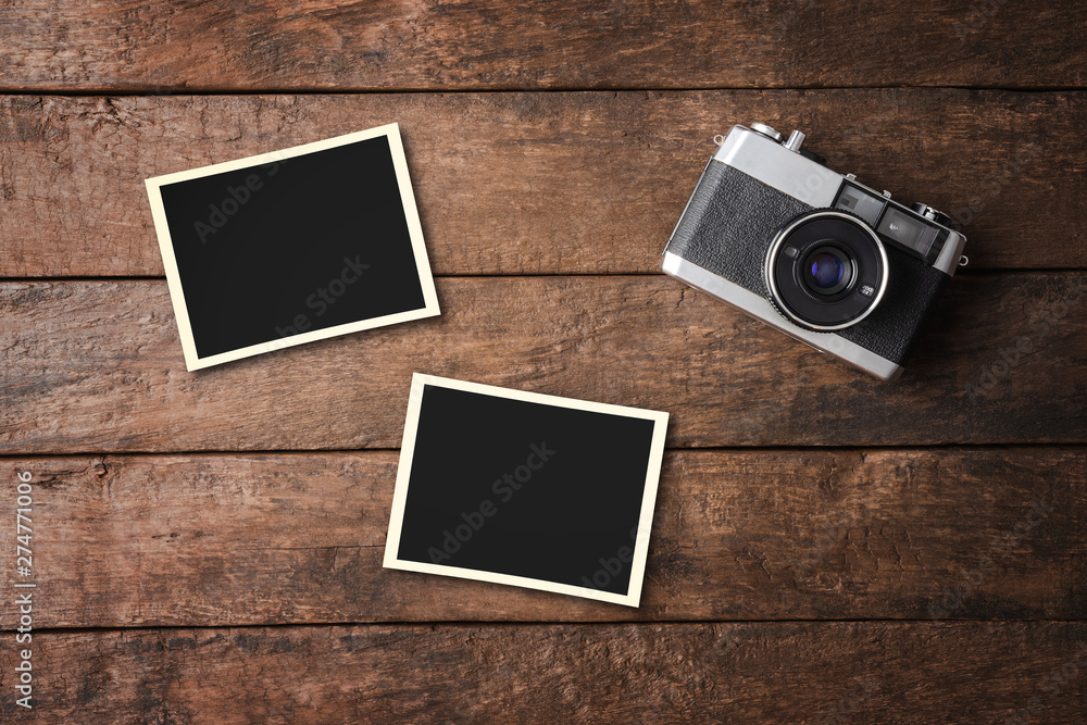 Vintage camera with empty photo frames. Top view - obrazy, fototapety, plakaty 