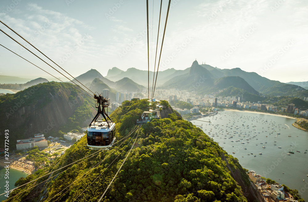 Cable car going to Sugarloaf mountain in Rio de Janeiro, Brazil - obrazy, fototapety, plakaty 