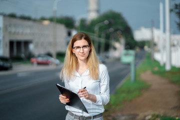 young beautiful woman walk on street spend time on fresh air