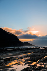 Canvas Print - Waves and Rocks at Beach at Sunrise