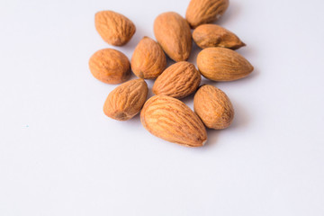 close up of  brown almonds seeds isolated on white background