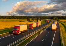 Intensive Highway Traffic At Sunset - Column Of Trucks On The Motorway In Poland