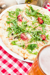 Wall Mural - Homemade italian pizza, fresh cherry tomatoes and basil, arugula served on wooden board