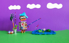 Fishing And Vacation Robotic. Fisherman Robot Caught Big Fish. Angler Accessories Rod Bucket Bait. Summer Clouds Scape, Blue Lake With Frog, Water Lily And Fish. Purple Yellow Sunset.