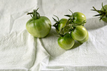 Fresh Green Tomatoes On White Fabrik