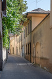 Fototapeta Uliczki - cityscape with old houses on bending street, Crema, Italy