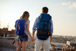 © NDABCREATIVITY - Young couple travelling with a map in the city
