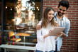 © NDABCREATIVITY - Portrait of a cheerful couple shopping online with laptop