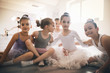 © NDABCREATIVITY - Group of fit happy children exercising ballet in studio together