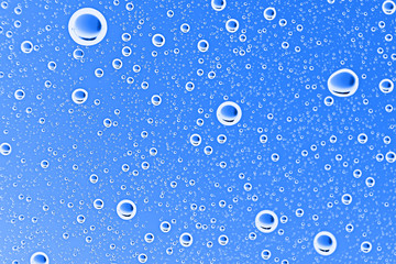 fresh drops background blue glass / wet rainy background, water drops transparent glass blue