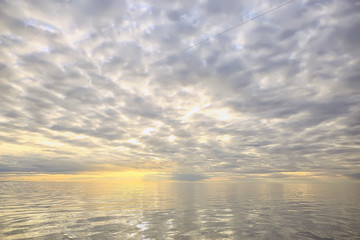 Wall Mural - sky above water / texture background, horizon sky with clouds on the lake