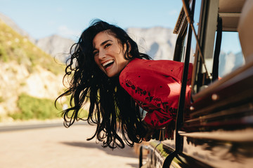 Wall Mural - Woman having a great time on road trip