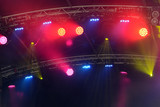Fototapeta Sport - stage lights on a concert. color