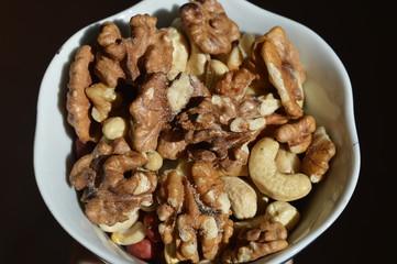 Walnuts in Cup close up on black background