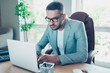 © deagreez - Close up photo handsome he him his macho guy best chief boss having online currency business chat email letters attentive notebook table sit big office chair wear formal-wear grey jacket blazer
