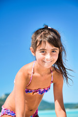 Sticker - Happy beautiful girl relaxing on a tropical beach