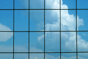  Clouds reflected in the glass facade of a skyscraper