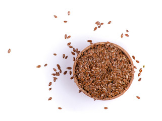 Wall Mural - flax seeds in wooden bowl on white background isolation