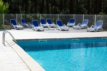 Wall Mural - Resort Swimming Pool and bathe chair blue water in summer