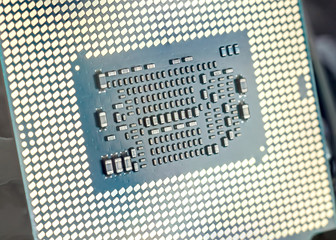 Engineer plugging CPU microprocessor to motherboard socket. Computer technology and hardware maintenance or repair.