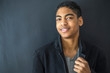 © Oleksandr - Portrait of a beautiful happy and smiling fashion afro American young man. Teenager mixed race black.