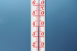 Fototapeta Mapy - Thermometer during hot weather with sky in background