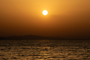 Sticker - Bright sunset with yellow sun the sea surface