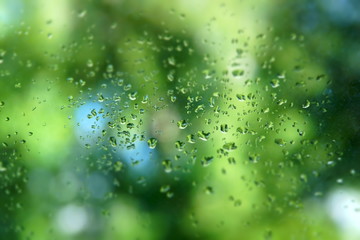 Canvas Print - rain water drops on window background closeup