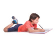 © cristovao31 - School boy lying on floor and drawing with pencil, isolated on a white background