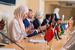 © pressmaster - Group of contemporary intercultural delegates clapping hands