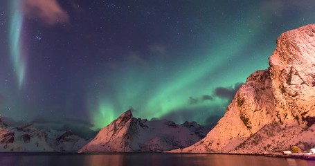lockdown time-lapse: aurora borealis hovering and passing above hamnoy norway - hamnoy, norway