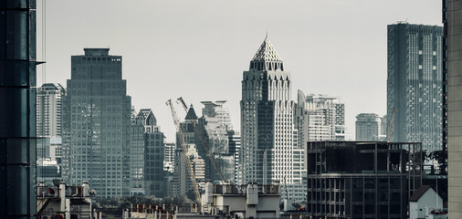 Poster - cityscape of modern building with filter darmatic tone background banner