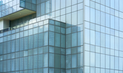 Glass windows of high rise commercial skyscraper building , for business concept background .