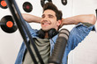 © Drobot Dean - Handsome happy young male radio host broadcasting