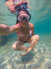 Underwater Selfie Of A Woman With A Diving Making In Yoga Position - In Lotus Position