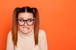 Close up photo beautiful amazing she her lady pretty hairdo bad mood sorry guilty expression bite lips mouth look side empty space wear casual pastel pullover clothes isolated orange background