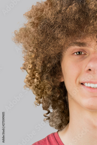 Split In Half Cropped Portrait Of A Young Curly European Man With