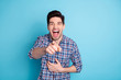 © deagreez - Close up photo funky impolite amazing he him his macho hand arm index finger indicating classmate rumors gossips yell announce you wear casual checkered plaid shirt isolated bright blue background