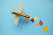 © EkaterinaVladimirova - small toy plane with autumn leaf. Autumn concept