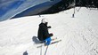 Expert male ski on fresh powder snow on ski slope in Bansko, Bulgaria, a world cup ski centar, slow motion