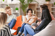 © Pixel-Shot - People calming woman at group therapy session